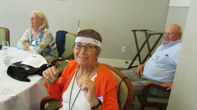 Drill Team member June Halmo Steinfeld proudly wears her headdress, with Gayle Halmo and Bill Steinfeld watching