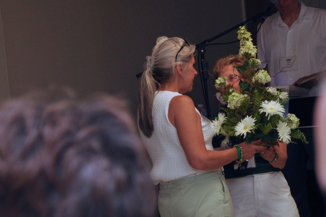 Part of CD Ram-Jam-2013 Album-by Paul Holtzman.  The Picnic Committee presented a flower arrangement (green & white, of course!) to CDHSAA President Debbie Groff Hoachlander 72.