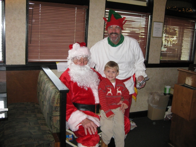 Alumni having fun in the community! Santa is Herb Wragg 58 and his elf is Jeff Hoachlander 74
