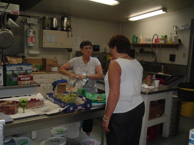 Kitchen prep begins early - Betty Blain Miller 63 and Patty Hall Miller 77 (back to camera)