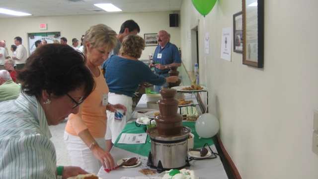 Bev Bosak & Carol Ritter test out the chocolate fountain.