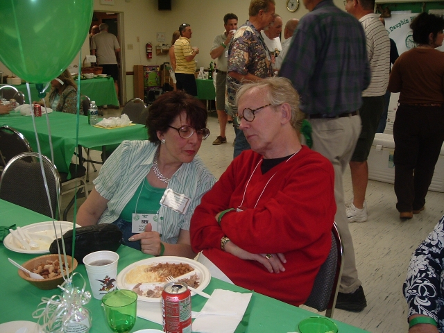 Bev Davidson Bosak 62 chats with classmate Chris Kingman 62.