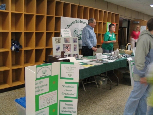 Retired teacher Ken Peiffer and Betty Blain Miller 63 greet attendees at our table.