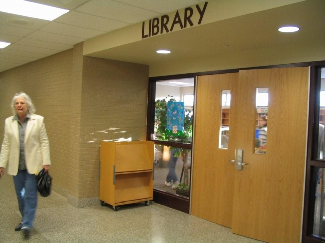 The former wrestling gym, near the back entrance, is now a library.
