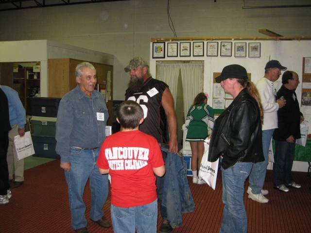 Coach Dick Shiffert is introduced to Mark Rosatis family.