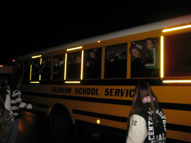 The cheerleaders bus arrives.