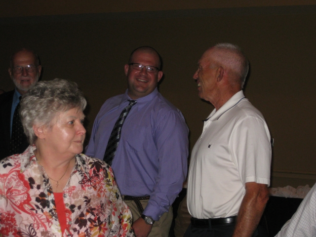 On the right is former CD wrestling coach John Kreamer.