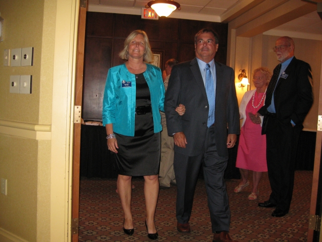 Inductee Tami Scola escorted by her husband, Dr. John Scola, former CDSD Superintendent.