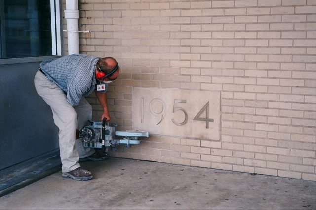 It was a hot day, and a tough job! Mike had lots of encouragement from the 50th Anniv. Committee though.