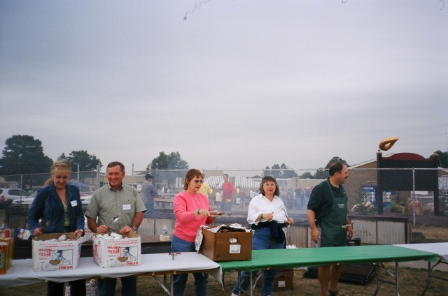 The Chicken Nazi (Jeff Hoachlander, Class of 74, far right) assembles his team to feed the masses. All went smoothly, and the crowd loved the meal.