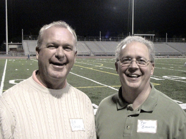 All smiles while admiring the new stadium turf.