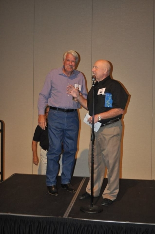 (73) Les Thomas accepting his golfing prize from David Watson
