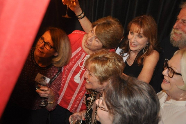 (66) How many people can be squeezed into the photo booth?