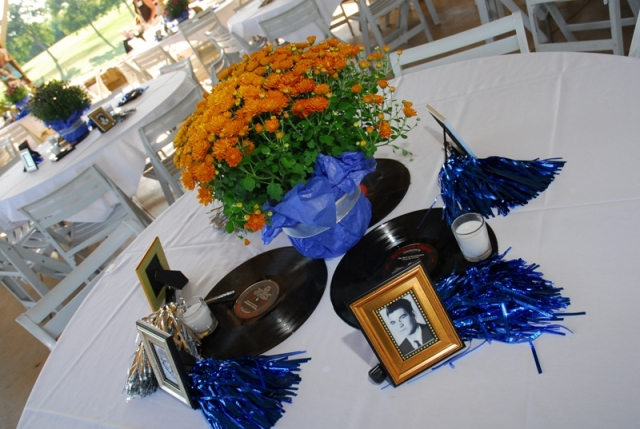 Table setting. Each student who pre-registered received a framed high school picture. Whoever was sitting at the table had to find the person to personally present the picture; a great idea to get people to mingle.