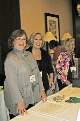 Elaine Miller, Maddy Hellman and Jackie Stern with welcoming smiles for classmates as they arrive at the reunion.