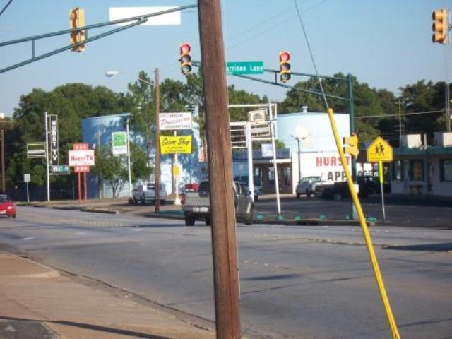 Looking west along Pipeline Road at Harrison Lane; Hurst T.V. is still in business in its same location.