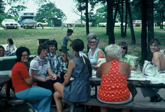 (048) 1975 Reunion Picnic Event:  ClaraJo Noble in the red, Gail Ince, Brenda Durant and Ruth Ann in the middle.  Maybe Candy McKnight in the light green blouse.  Nancy Morgan on the right looking over her shoulder.
 
Still an ID on the two ladies in bl
