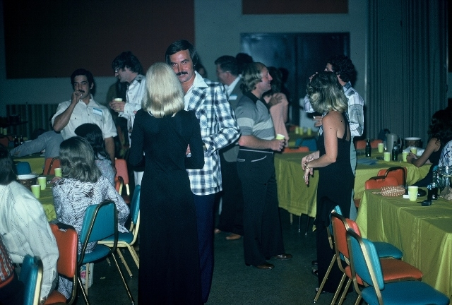(001) 1975 Reunion Evening Event: Joe Gonzales in the left background. John Edgington (plaid jacket) talking to Wendy Pickens. David Watson in the center background. Susan Starnes facing David. Recognize anyone else?
