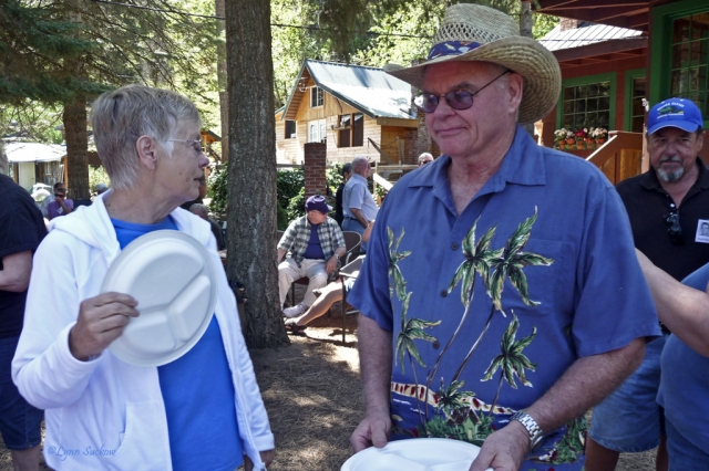 Jackie Hague, Leon Hagen (Kay Hendersons hubby), and Fred Moore in line for food.