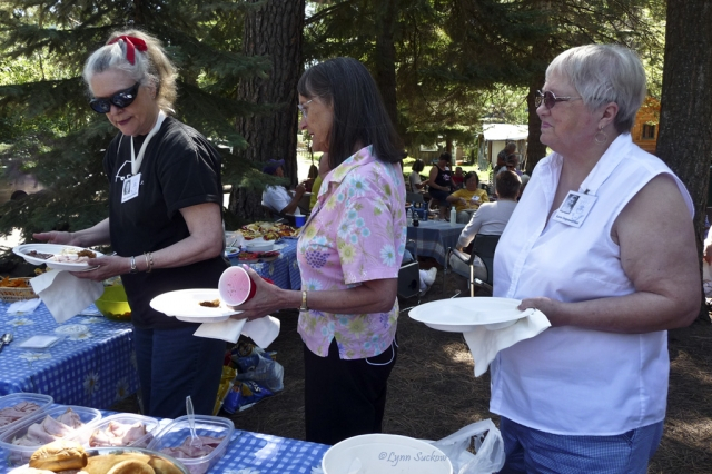 In line for food:  Judy (Alexander) Selleck, Doyne Morrison, and Karen (Jorgenson) Hust