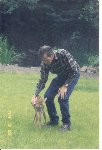 Buford and Lucky, a 2-day-old fawn (One of Anns favorite photos).