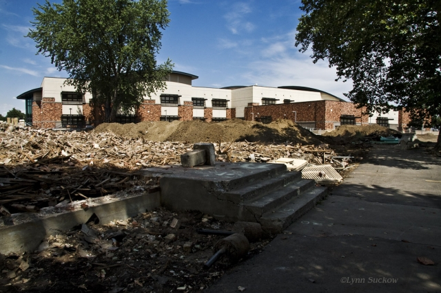 New Edison structure rises behind rubble of the old Edison--only the front stairs remain intact.