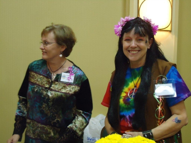 Harriet McHughes Johnson and Carolyn House Fohl checking in people at the Dinner