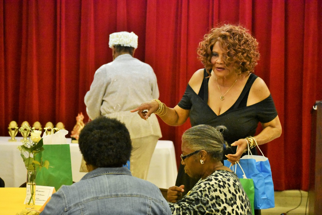 Ms. Della Rogers, Executive Secretary, CGDA handing out Gift Bags to Honorees.