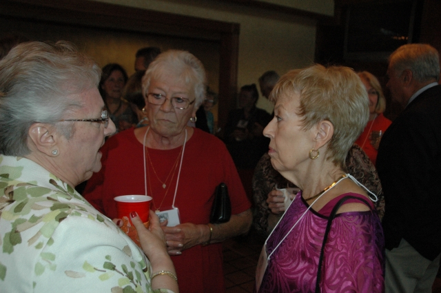 Joan Kontos Birner, Julie Strelecki Boverie, and Nancy Harris Alexander
discuss old times