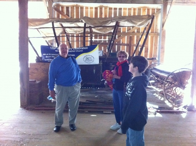 John Vaughan in front Amish Hay Bailer.