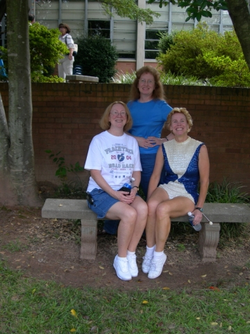 McCorvey family girls in courtyard (seated: Diane 68, Gail 73, majorette, standing: Jennie M. Fleming 72, also majorette