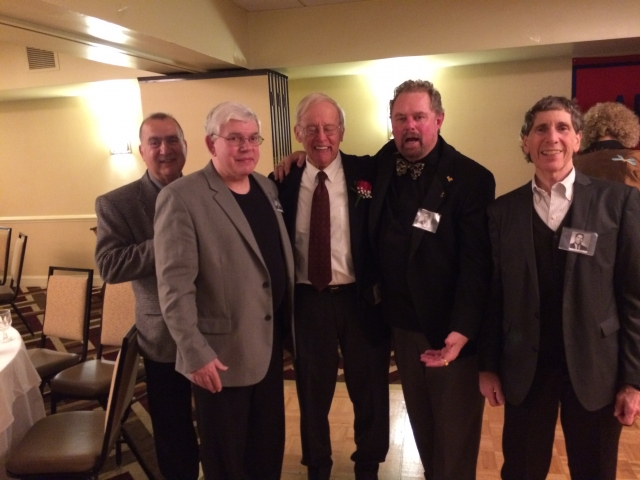 Coach Schluntz with football teammates Don Cole, Andy Levas,John Merrick and Alan Nathan 