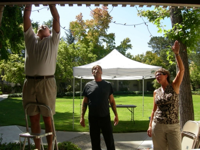 Chris Marx, Don Bishop, and Barbara Pedro helping decorate for the mixer