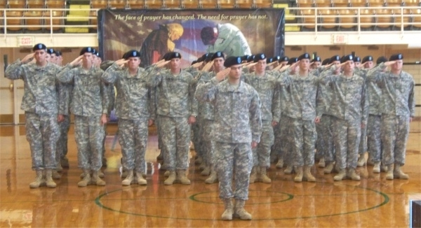 The Salem National Guard unit gives a salute at their deployment ceremony Saturday, August 23 at Salem Community High School.