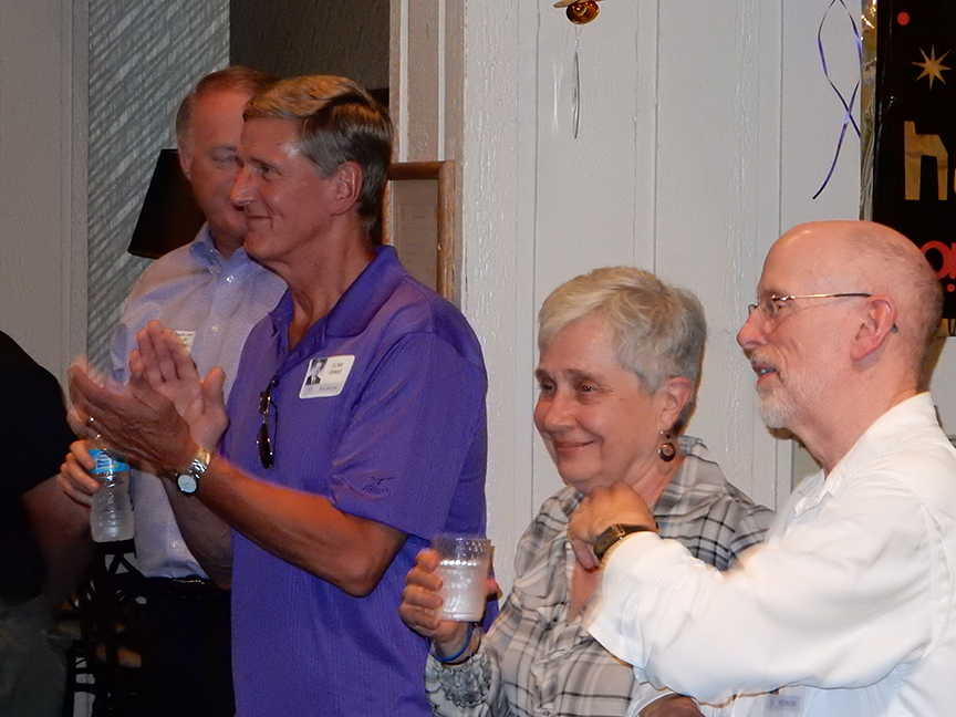 Dudley Mitchell, Clive Grant and Bob Busch applauding Nancy Nagel Gibbs on her successful production of the Broadway play, Peter and The Starcatcher, in 2013.