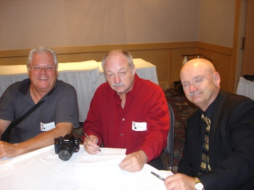 AS the evening comes to an end, Al Moore, Mark Anderson and Dave Smith fill out the reunion questionnaires. If you didnt fill one out that night, do it on the website.
