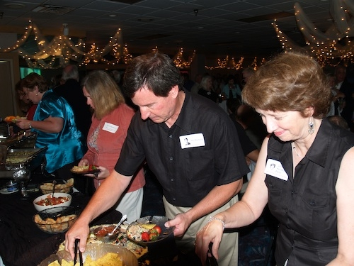 Anne Gluesing, Jim Gluesing and Cathy Kennedy Paine at the hors doeures table.