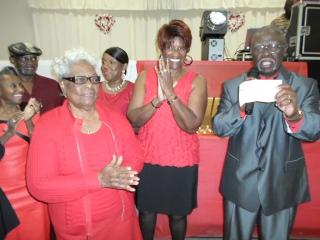 Mrs. Johnson donating to scholarship fund at annual dance 2013