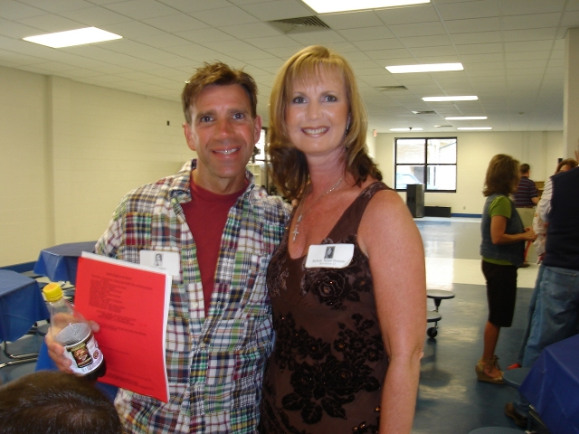 Chuck Adams & Melinda Harper Bonnette discuss last minute details.  Where is the cordless mike??? 