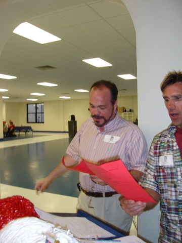 Chuck surprises Arnold by asking him to lead in the Alma Mater!