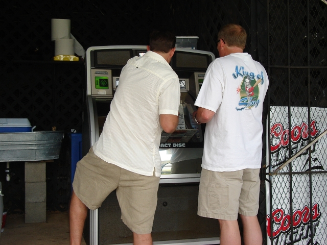 Chuck Adams and Ron Huey picking songs on the juke box.  We want 70s tunes!  