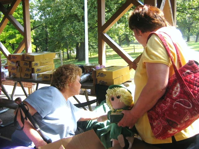 Sandy Grubb Chapman with Andrea Parker of Girl Scouts of NE Kansas & NW Missouri  She is giving her moms (Thelma Grubb) Girl Scouts treasurers saved from Troop 47 for way over 50 years.   