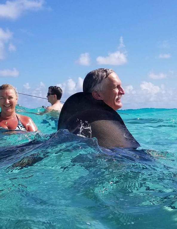Tim getting a hug from a stingray
