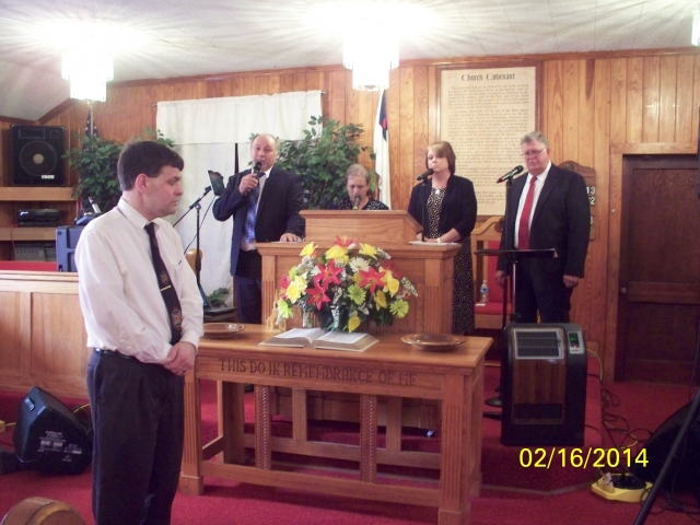 And no service is ever complete for The Waylighters Quartet without an altar call. Here, Pastor Shane stands ready to pray while the group finishes with the song, Hes Alive!