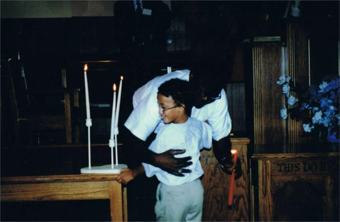 Clinton hugging Lil Mack