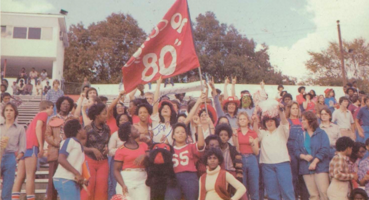 At stadium with 1980 flag