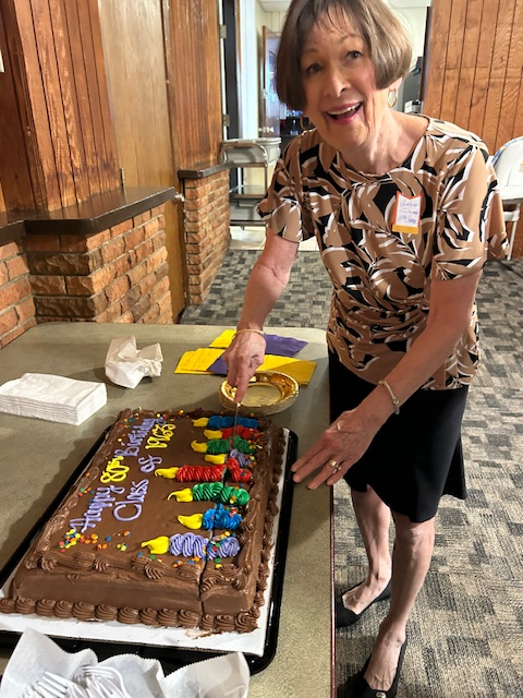 Vernie Quinn McCabe cutting cake