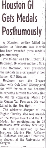 Robert Robinson receives Viet Nam honors. Medals include bronze star with V and oak leaf cluster for valor and heroism.