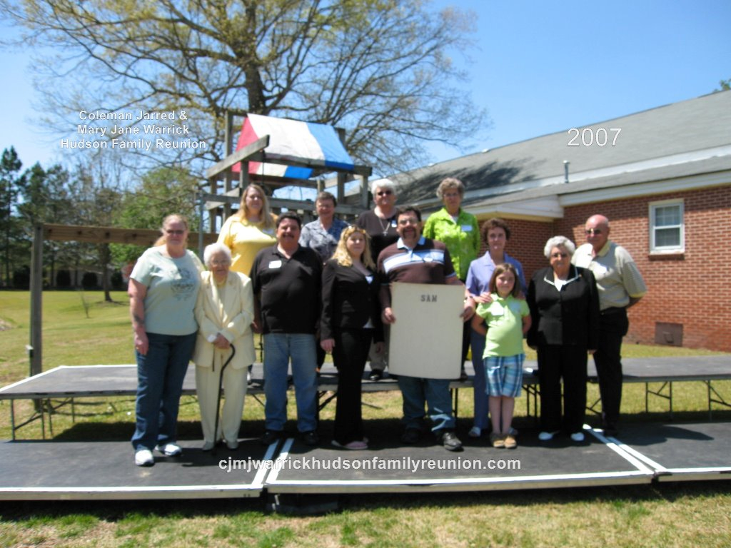 2007 – Family of Sam:
Front Row – McKayla Smith.
Second Row – Linda Hudson, Mabel Hudson Bishop, Lyn Hudson, Samantha Hudson, Sam Hudson, Alice Roberts, Isabelle Hudson Roberts, John Roberts.
Third Row – Mary Hudson, Barbara Hudson, Gwen Bishop, Sue Sutt