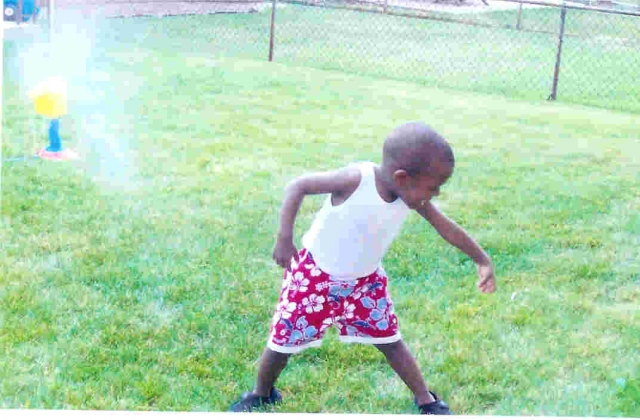 Little Leroy playing in the water sprinkler.